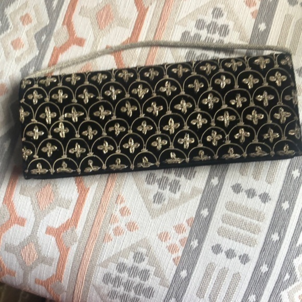 Hand made clutch evening‎ bag elegant detail in black and gold.